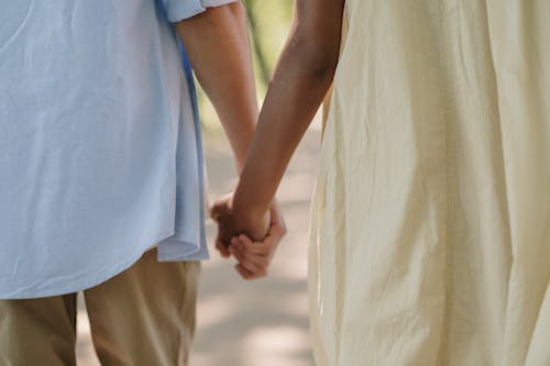 Teenage couple holding hands