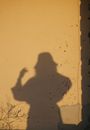 A shadow silhouette of a woman on a wall