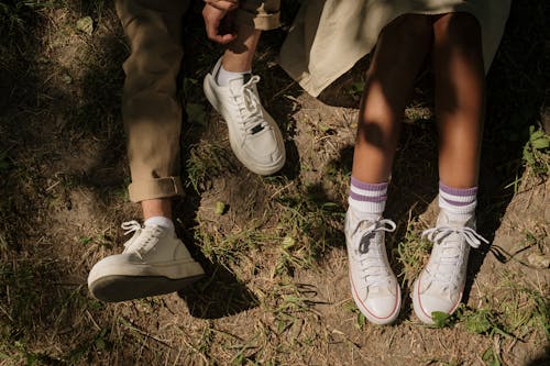 Legs of teenagers sitting