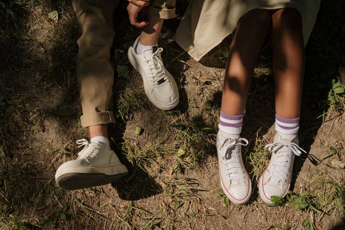 Legs of teenagers sitting