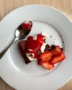Sliced Strawberry and Chocolate Cake on White Ceramic Plate