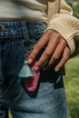 Close-up of girl touching charm