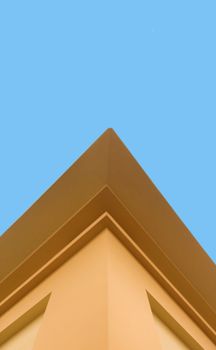 Geometric architectural facade against a vibrant blue sky in Gia Lai, Vietnam.