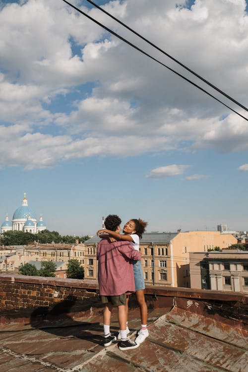 A Couple Hugging on a Rooftop