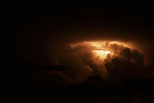Capture of a powerful lightning storm illuminating a cloudy sky over Santa Maria, Brazil.