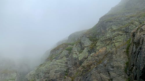 A Rocky Mountain on a Foggy Day