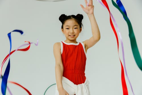 Free A Girl With Ribbon Tapes on Her Hands Stock Photo