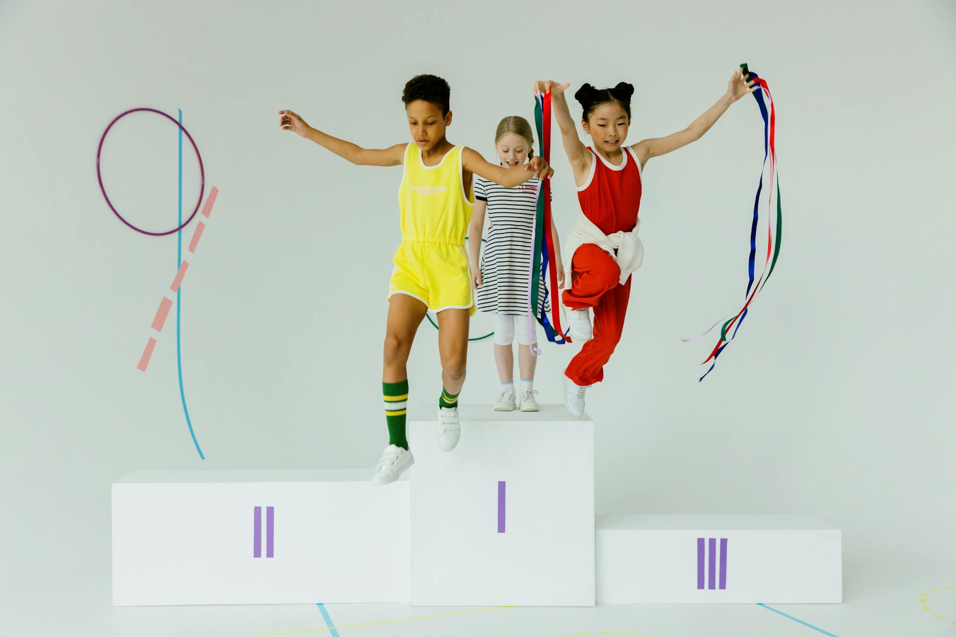 Girls Jumping From Olympic Podium Stand