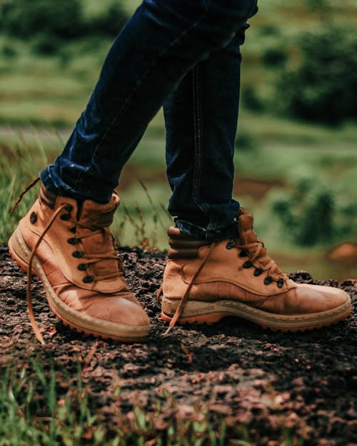 Person Wearing Brown Leather Boots Standing on the Ground