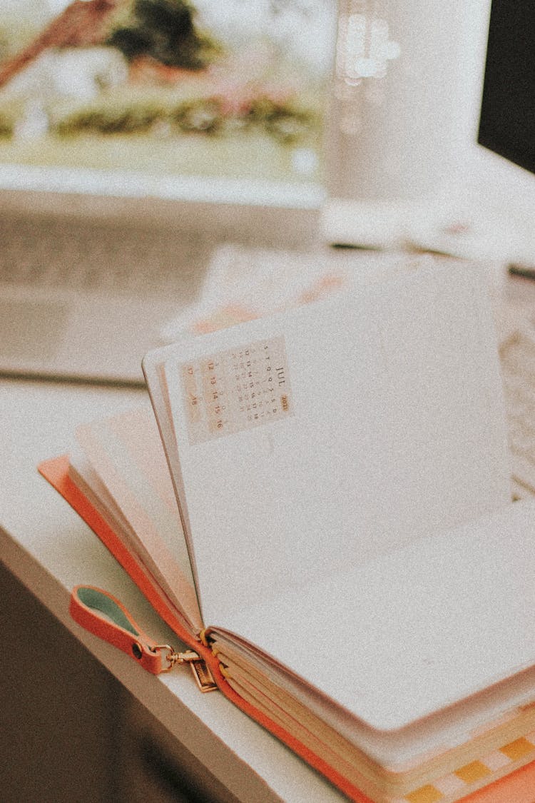 Photograph Of A Planner With Blank Pages