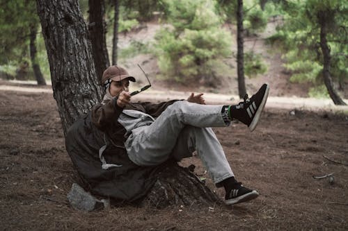 A Woman Reclining on a Tree Trunk