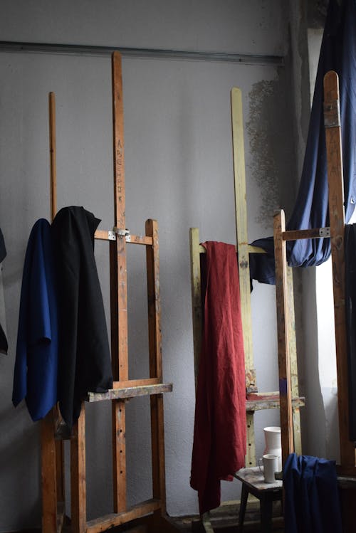 Textiles Hanging on Wooden Easels