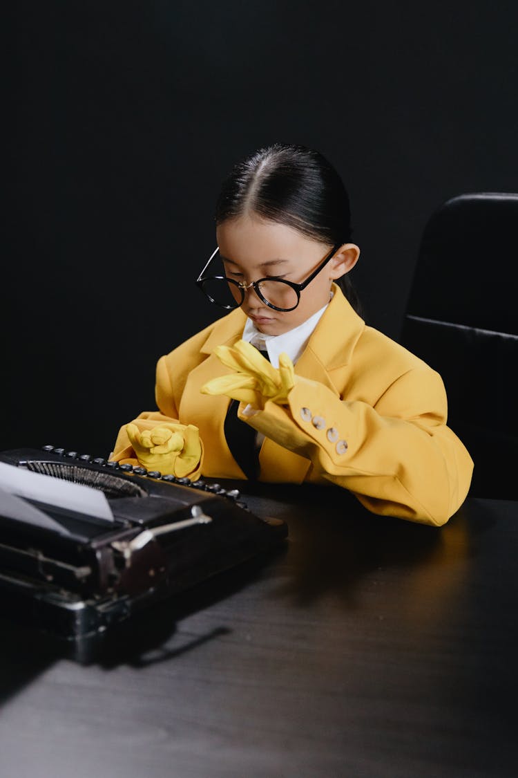 Asin Girl In Yelow Suit Typing On Typewriter