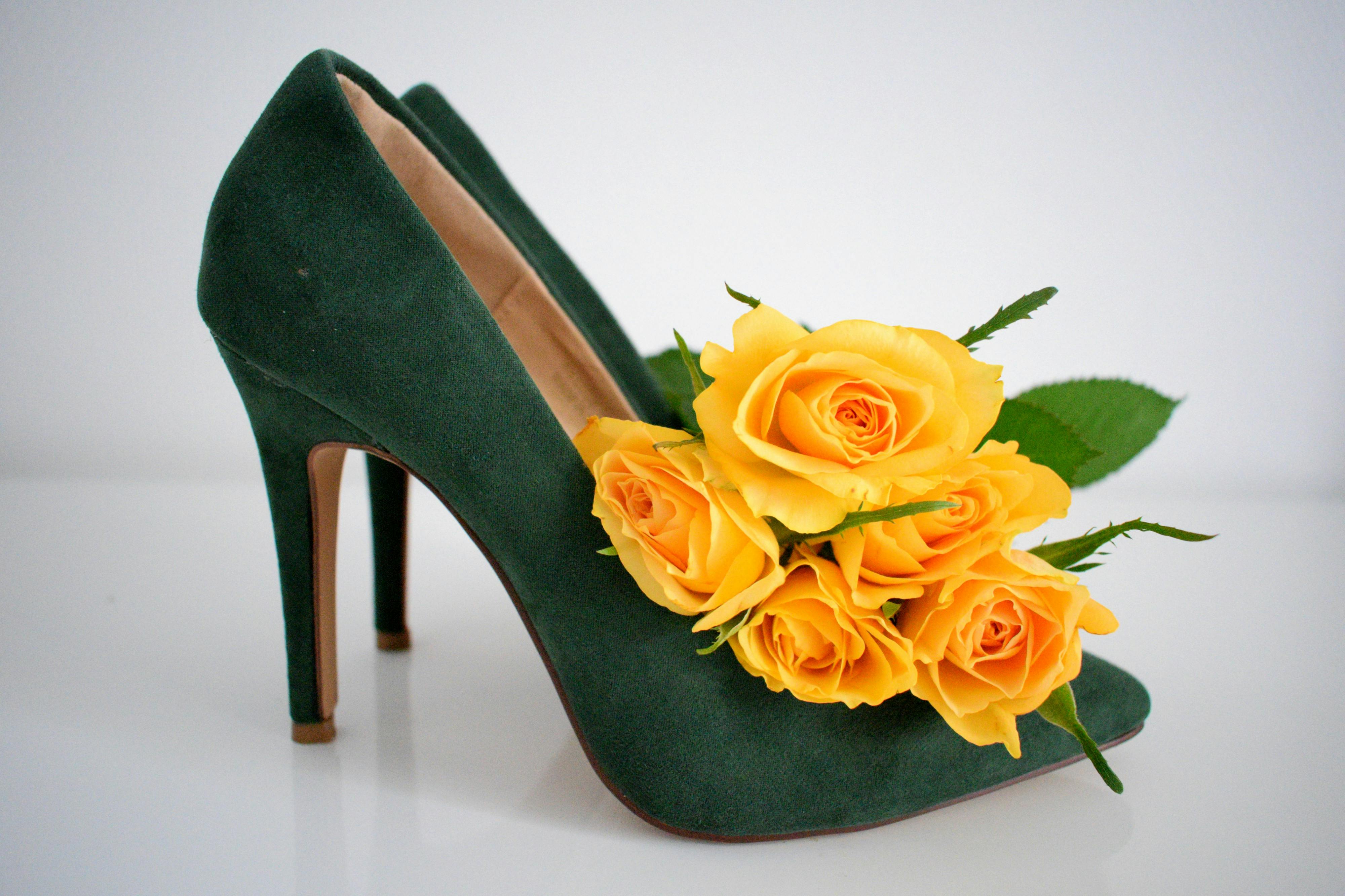 CloseUp Photograph of Green Heels with Yellow Flowers · Free Stock Photo