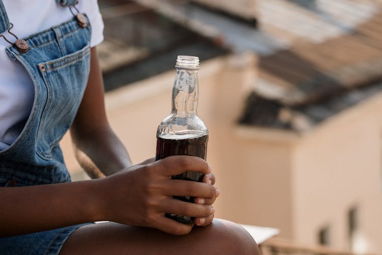 Girl Holding Cola Bottle