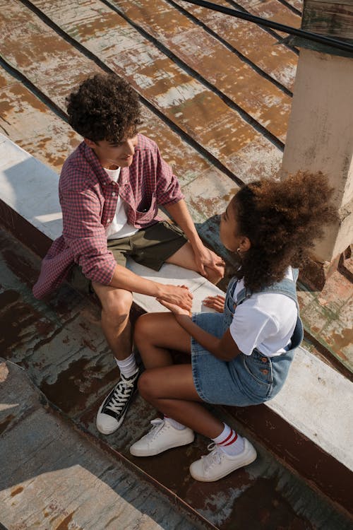 Young couple holding hands on rooftop