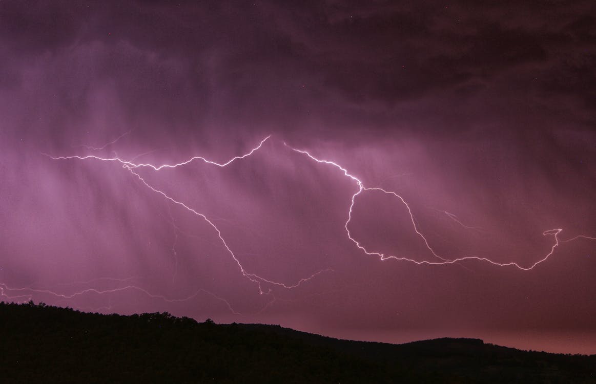 Lightning Strike Above Mountain During Night Time