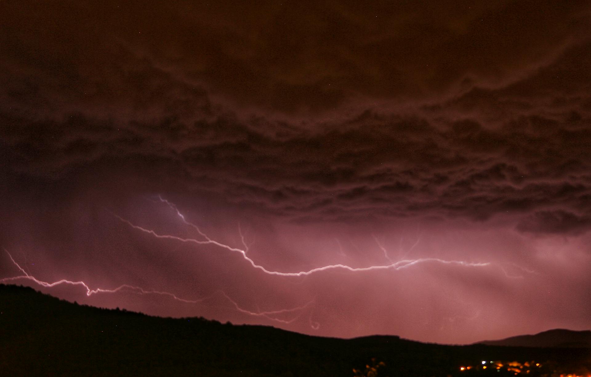 Captivating lightning strikes during a stormy night, showcasing nature's electric power.