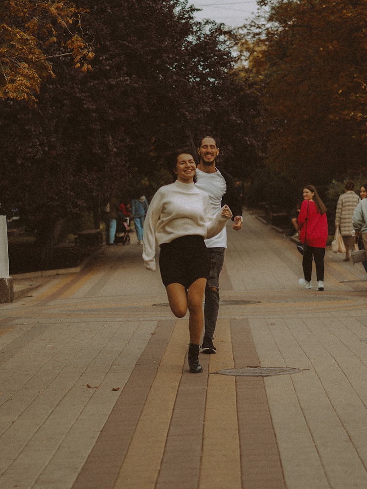 A Man And Woman Running Together