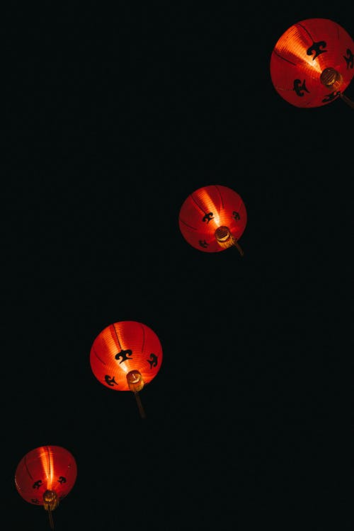Free Lighted Chinese Lanterns in a Dark Night Stock Photo