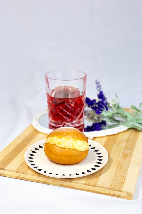 A Bread and Juice on the Wooden Tray