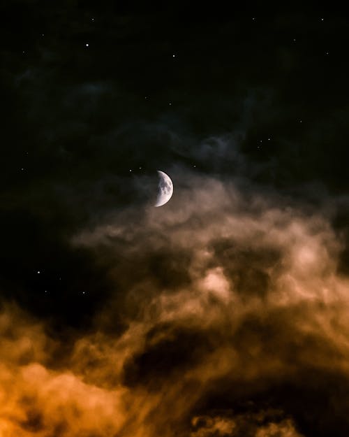 Half Moon Over Dark Clouds