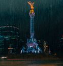 Green and Yellow Lighted Tower during Night Time