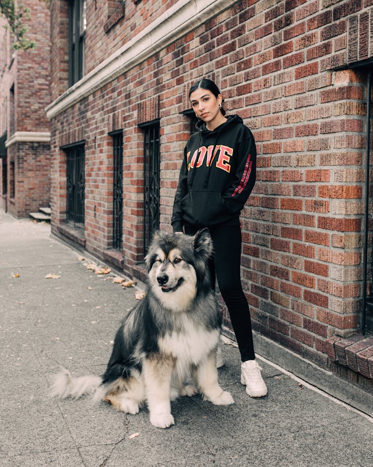 A Woman Standing Outside With Dog