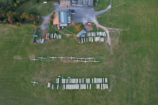 Aerial view of glider planes on a grassy airfield in Central Bedfordshire, England.