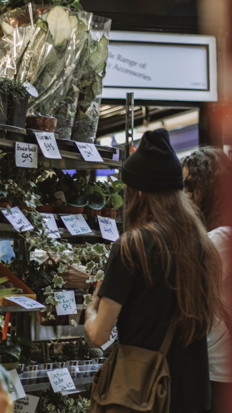 Women Buying Plants In The Market