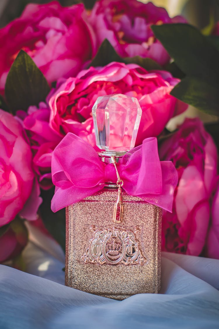 Gray And Pink Labeled Fragrance Bottle