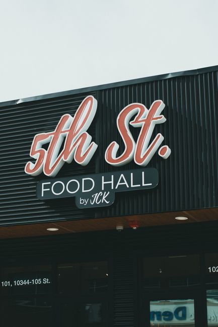 Modern signage of 5th St. Food Hall by JCK on a building exterior.