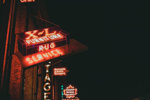 Colorful neon signs of vintage stores at night, captured on a bustling street, creating a vibrant and nostalgic atmosphere.