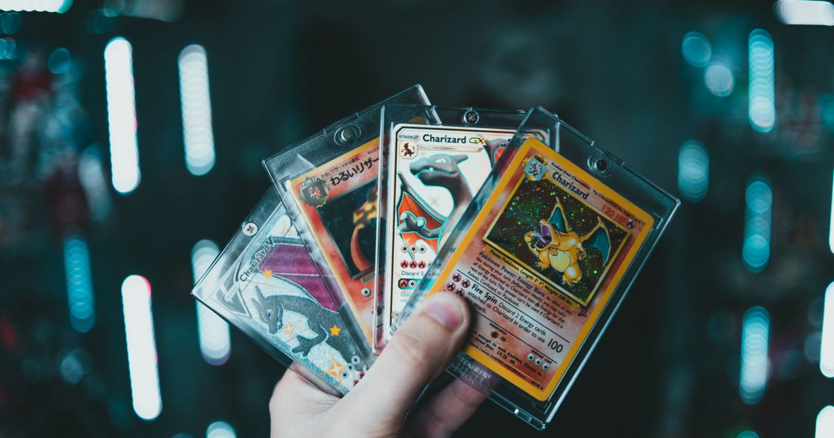 Person holding trading cards