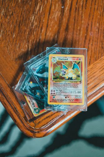 Trading cards laid out on a table for comparison
