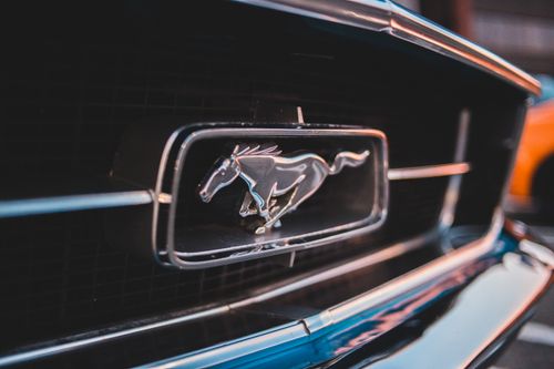 Free Detailed close-up of a classic Mustang car emblem, showcasing iconic automotive design. Stock Photo