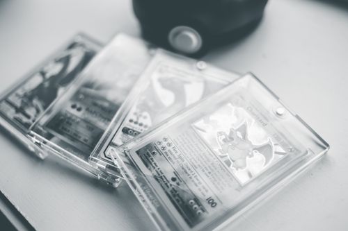 Free Close-up of collectible Pokemon cards in protective cases, emphasizing preservation and value. Stock Photo
