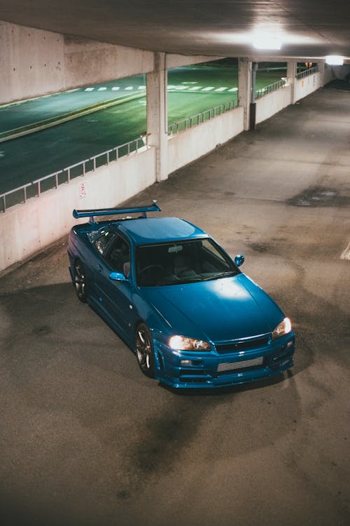 Blue Car in the Parking Lot