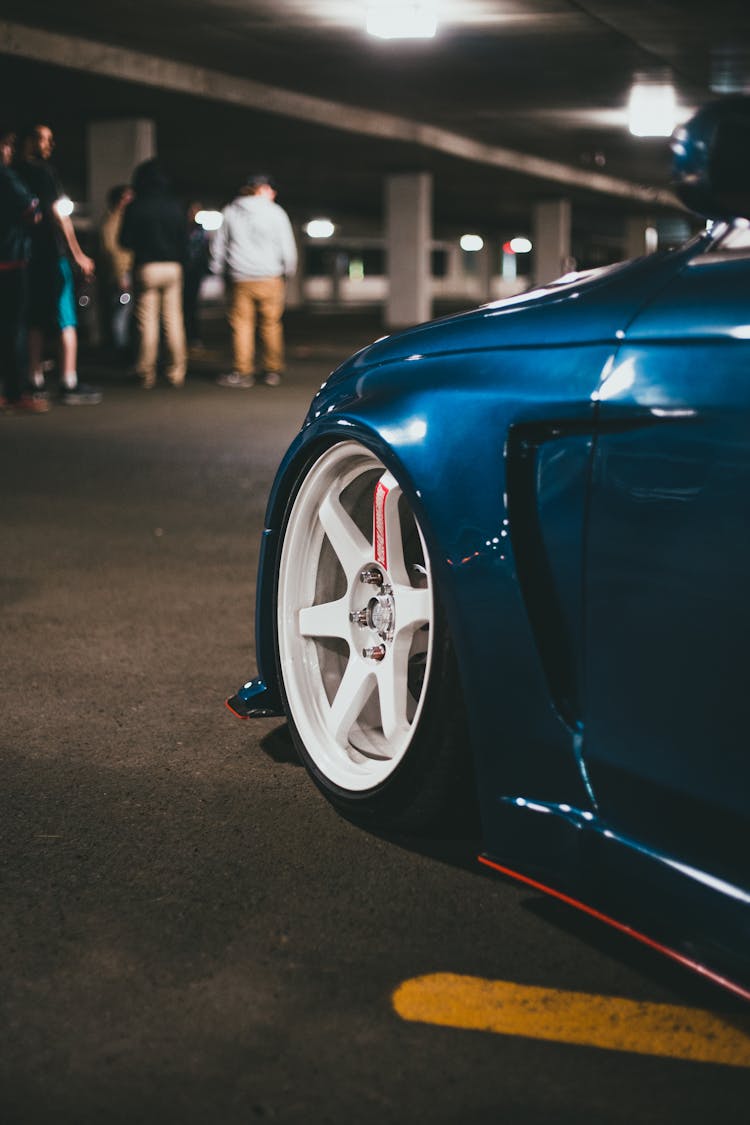 Modern Car And People In Underground Garage