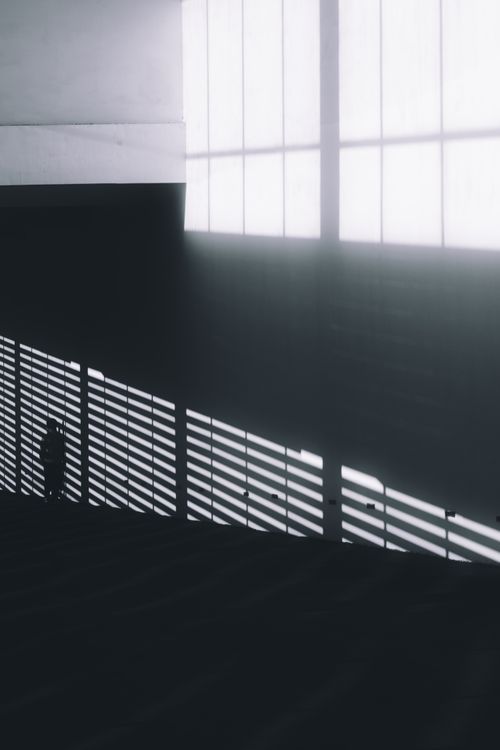 Free Abstract silhouette against dramatic shadows and architecture. Stock Photo