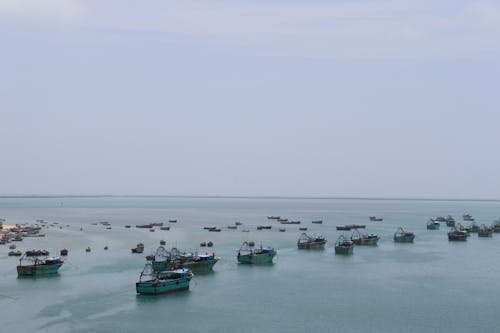 Drone Shot of Fishing Boats Anchored near Shore