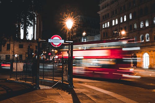 Free Long Exposure of a Double-Decker Bus at Night  Stock Photo