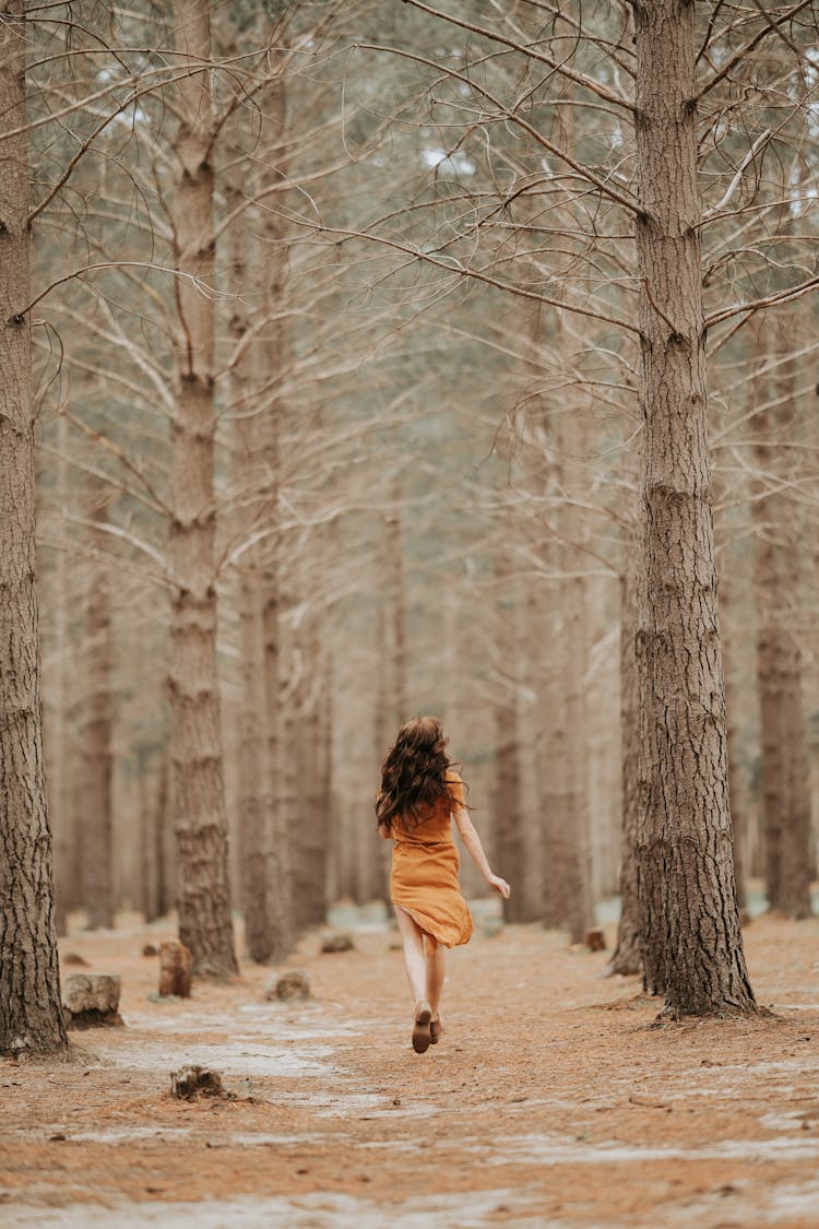 Adult Woman Running In Dress Forest