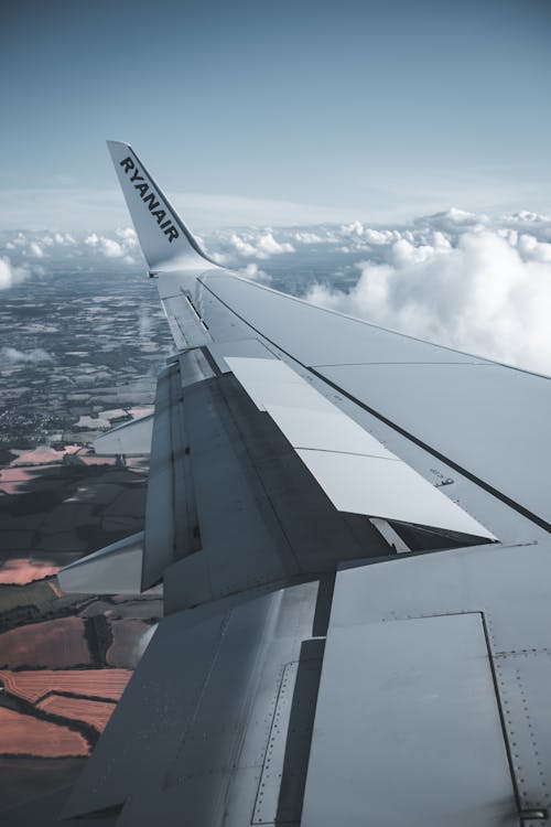 Free Airplane Wing above Clouds Stock Photo