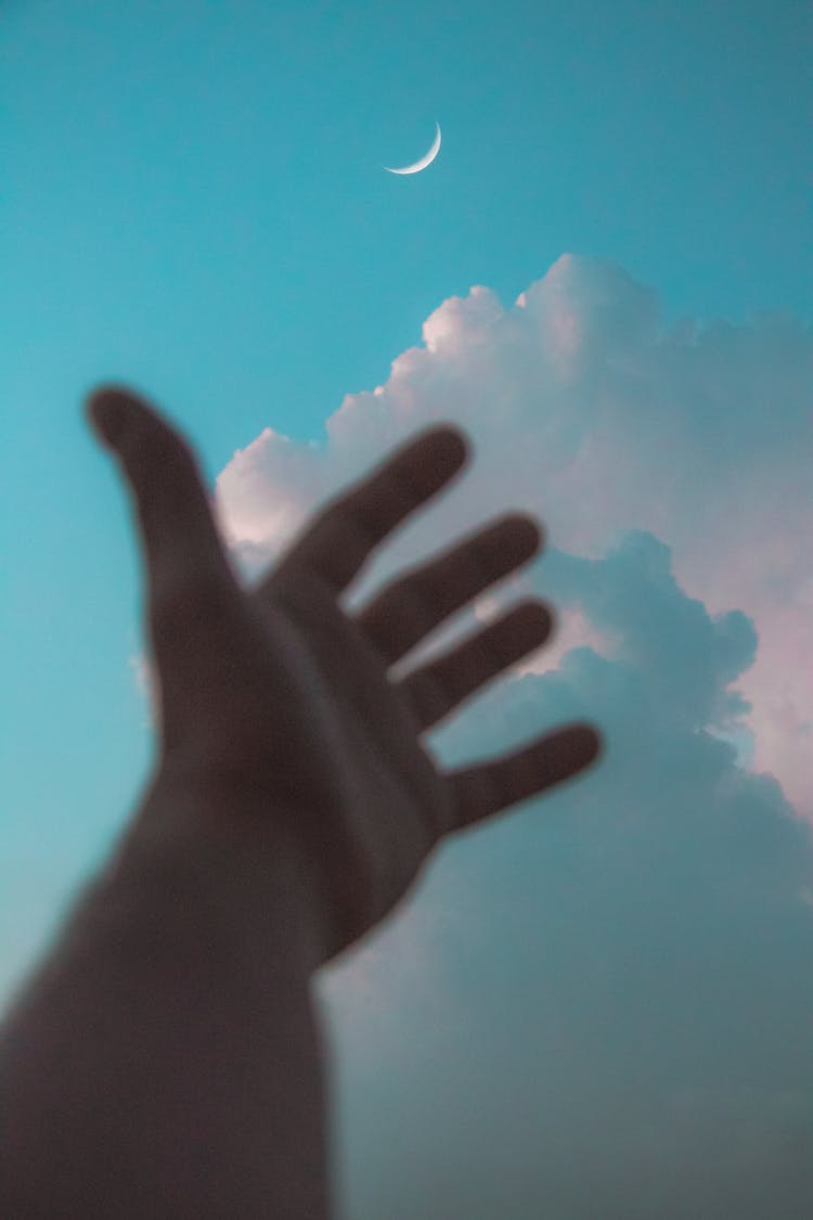 Person Reaching Out To The Sky