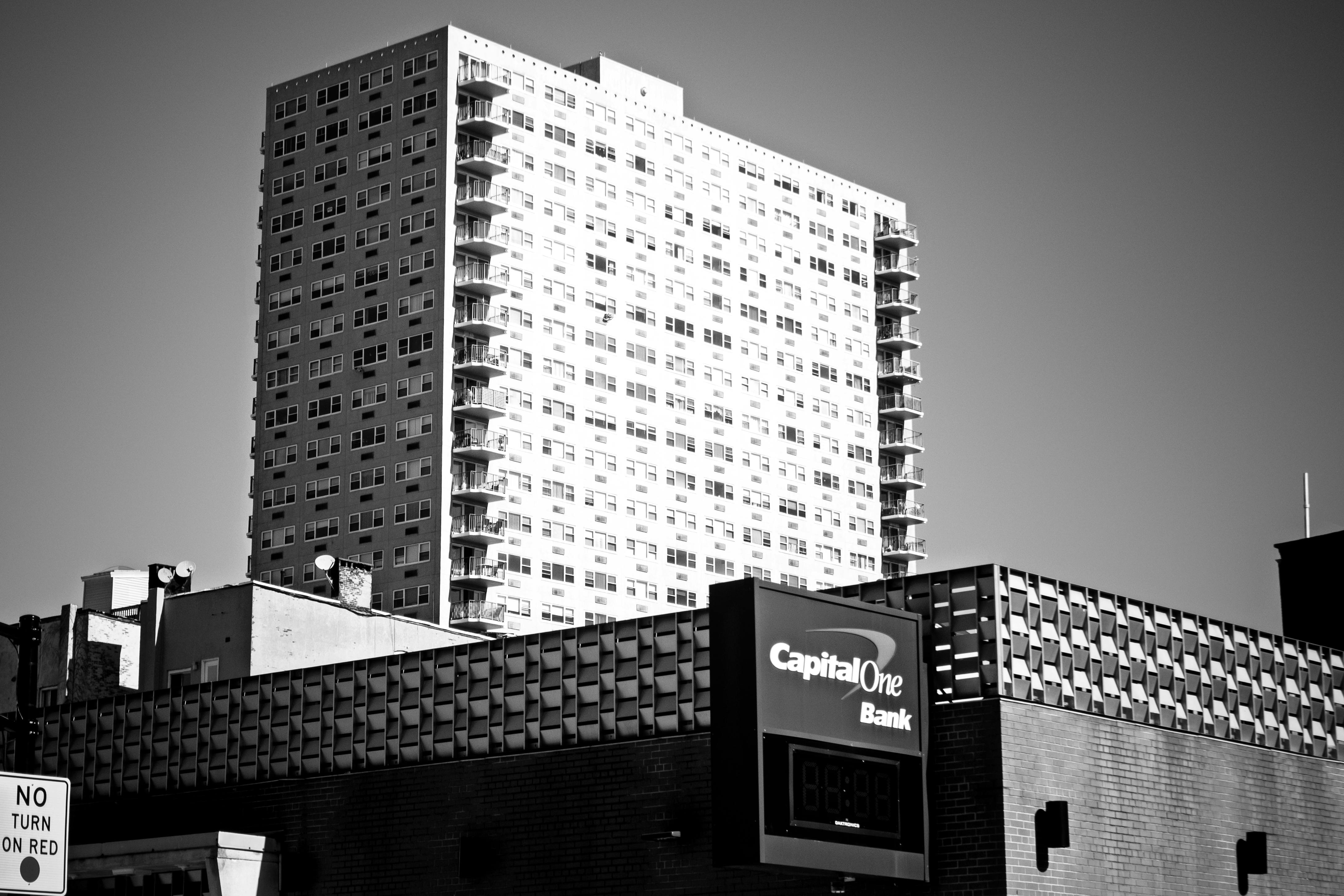 Black and white photo of a high-rise and Capital One Bank in Hoboken, NJ.