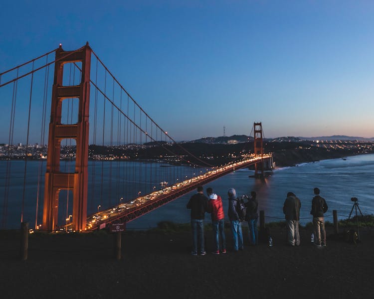 People Standing Near The Golden Gate Bridge