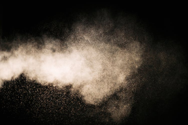 White Dust Particles On Black Background