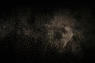 White Dust Particles on Black Background