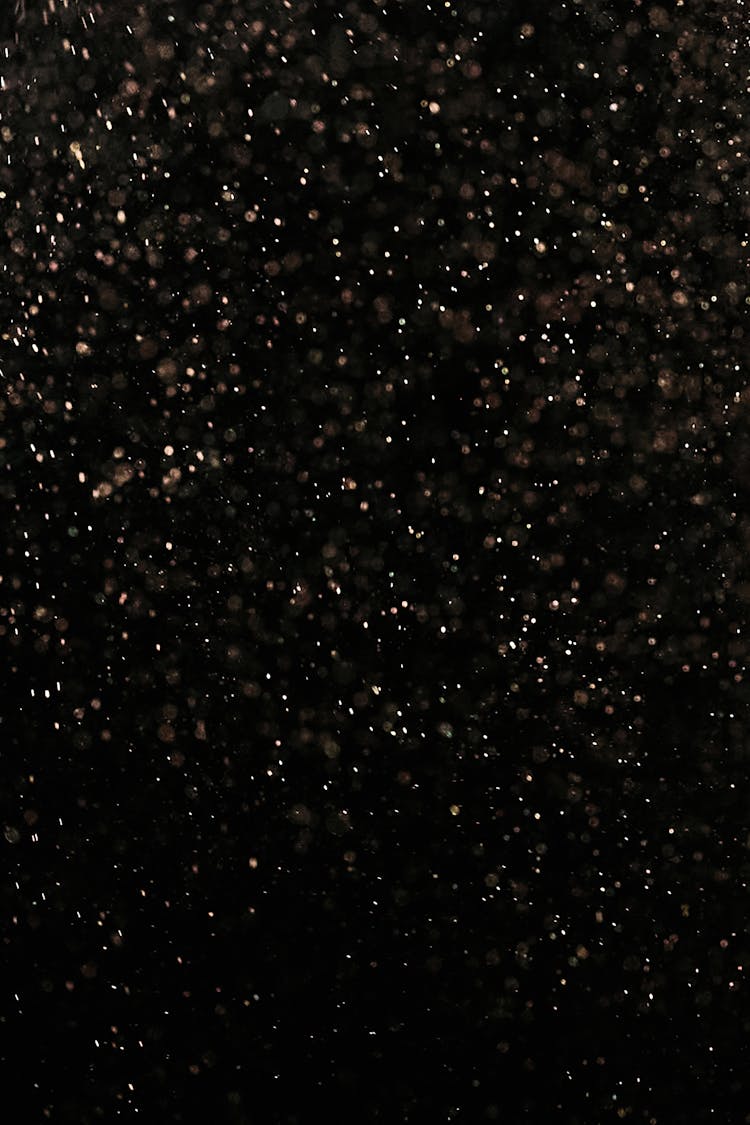 White Dust Particles On Black Background